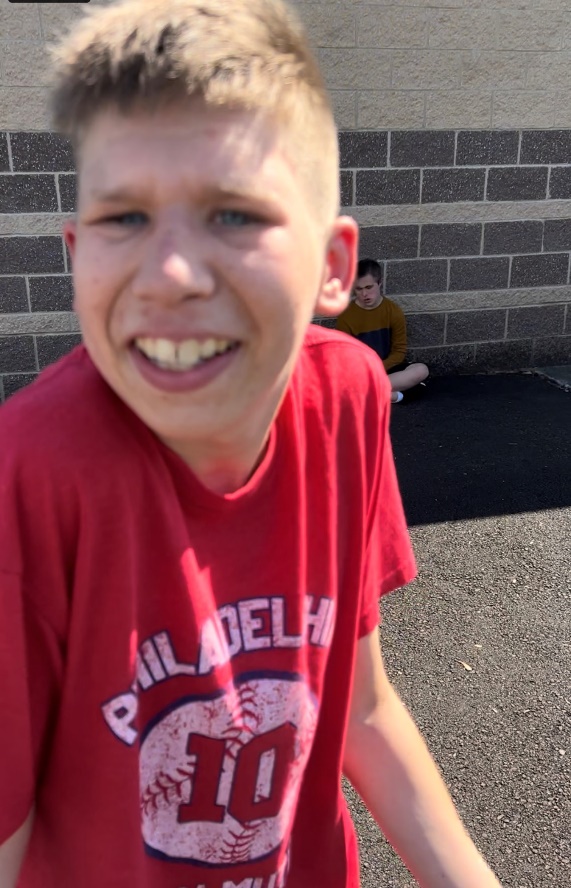 A child in a red shirtDescription automatically generated with medium confidence